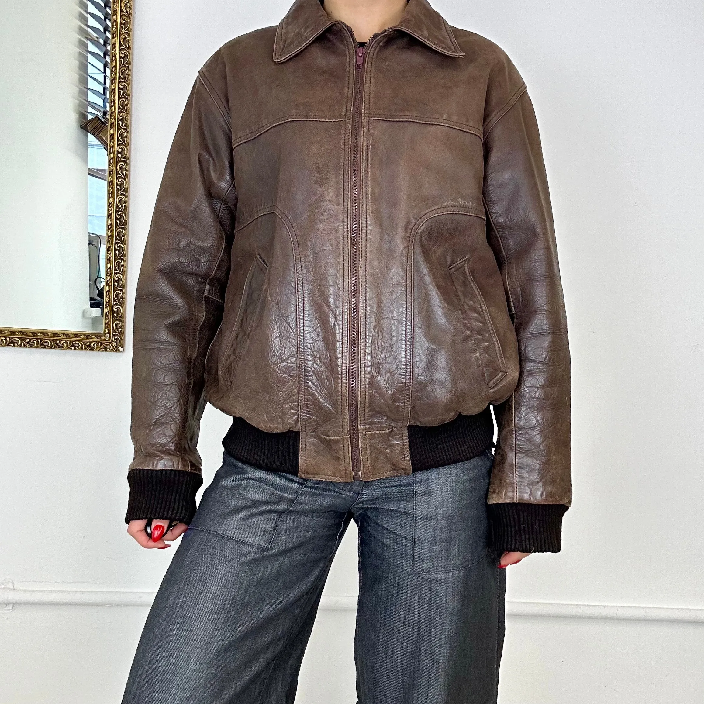 brown leather bomber jacket.