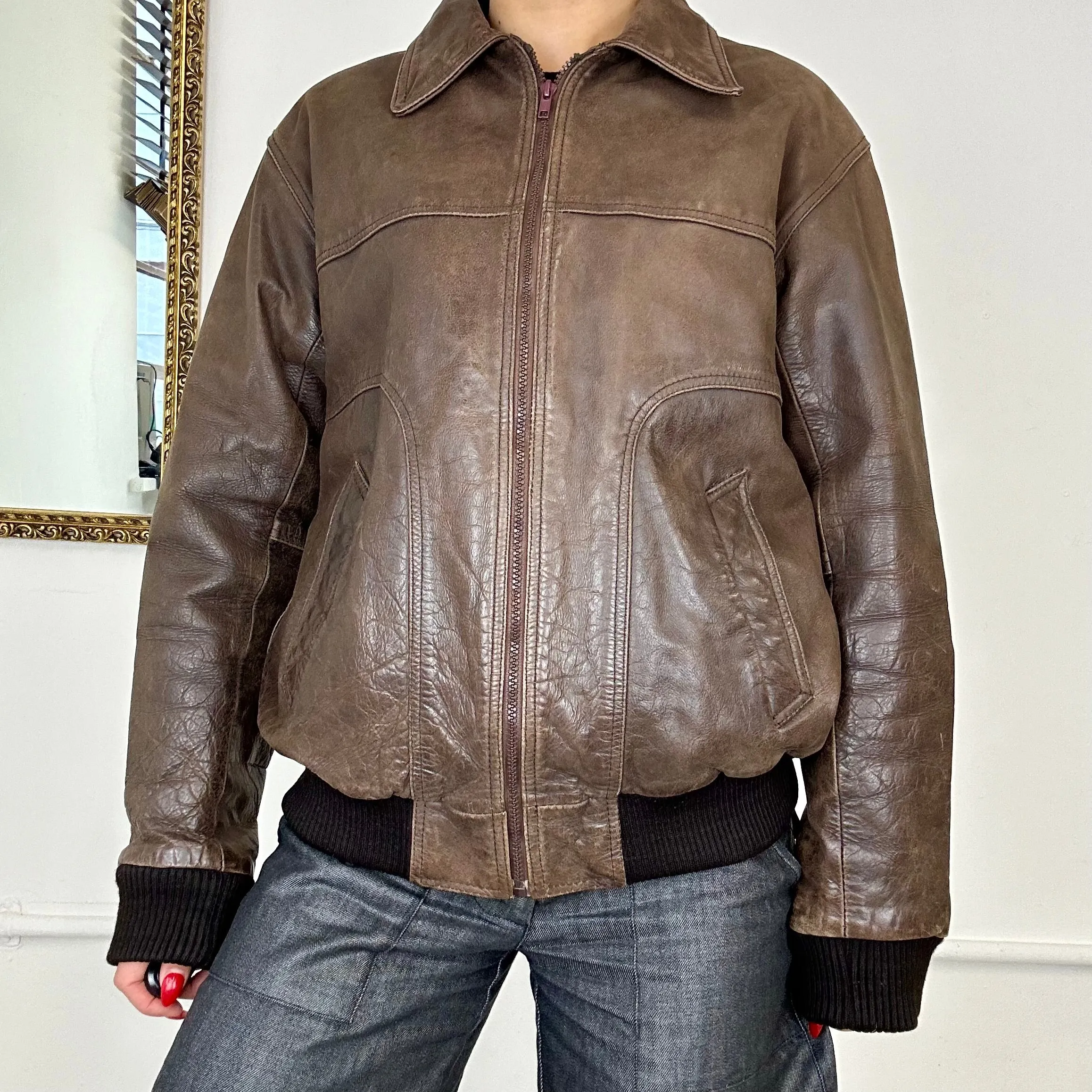 brown leather bomber jacket.