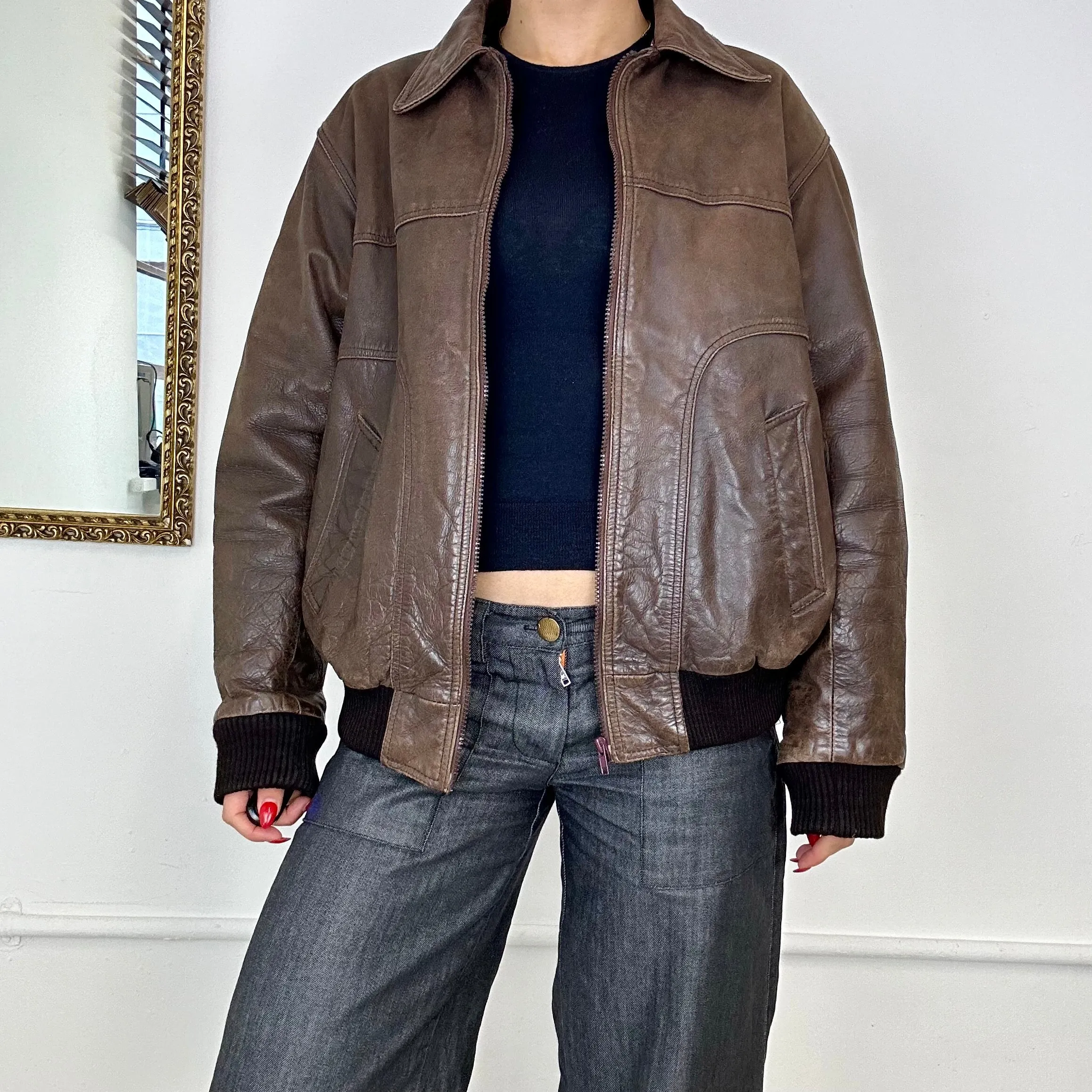 brown leather bomber jacket.