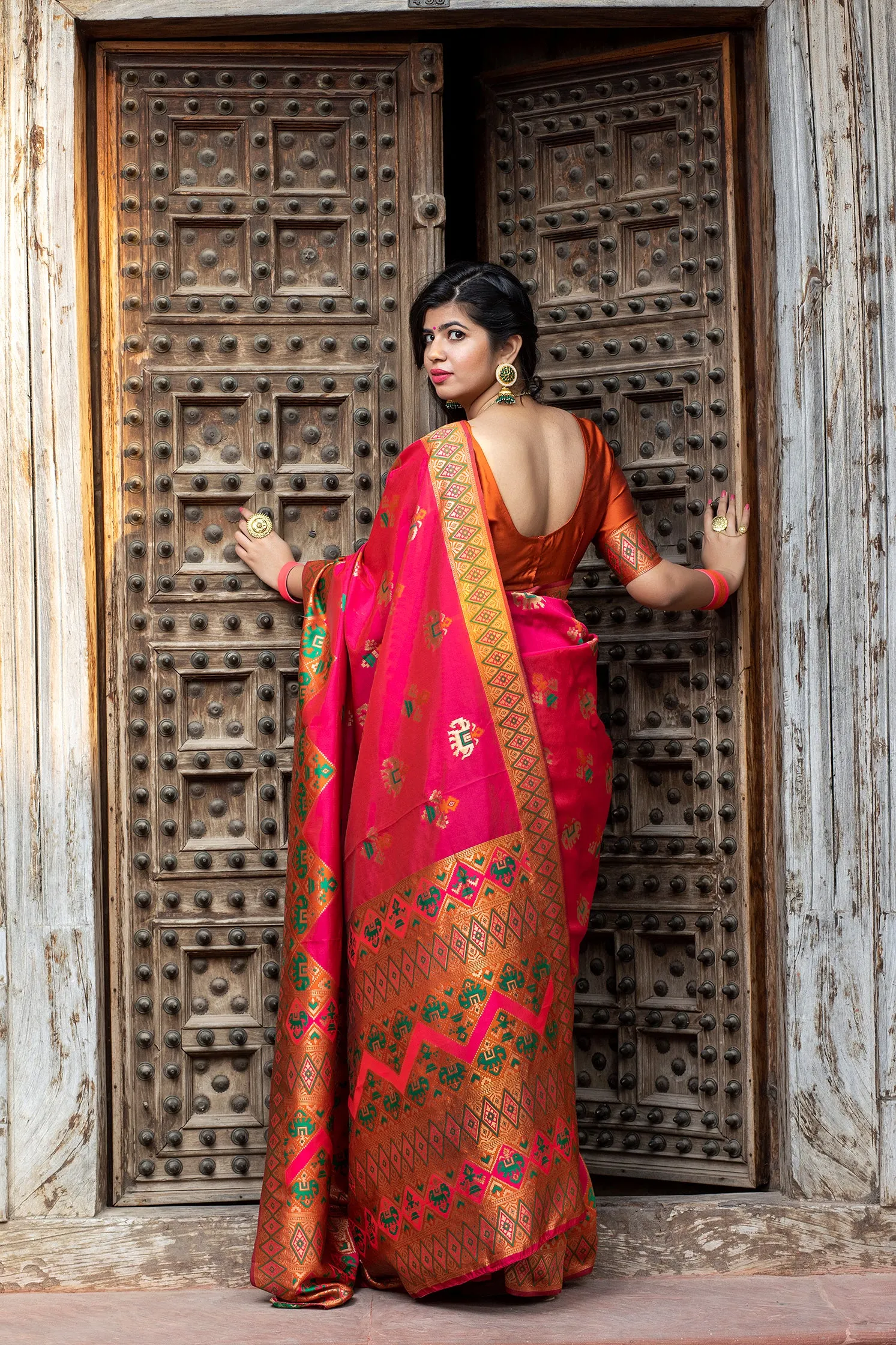 Glamourous Dark Pink Woven Silk Patola Fancy Saree