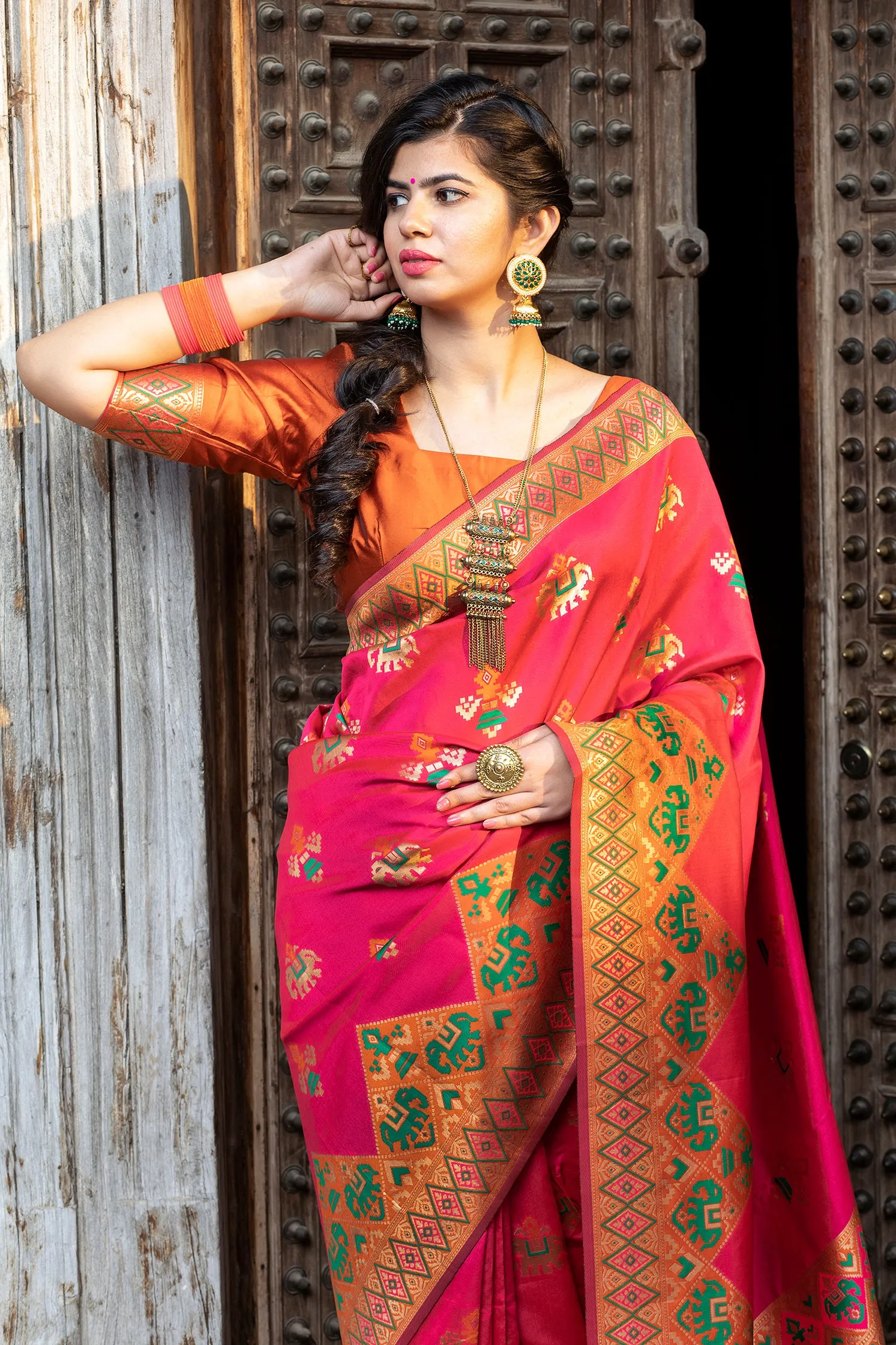 Glamourous Dark Pink Woven Silk Patola Fancy Saree